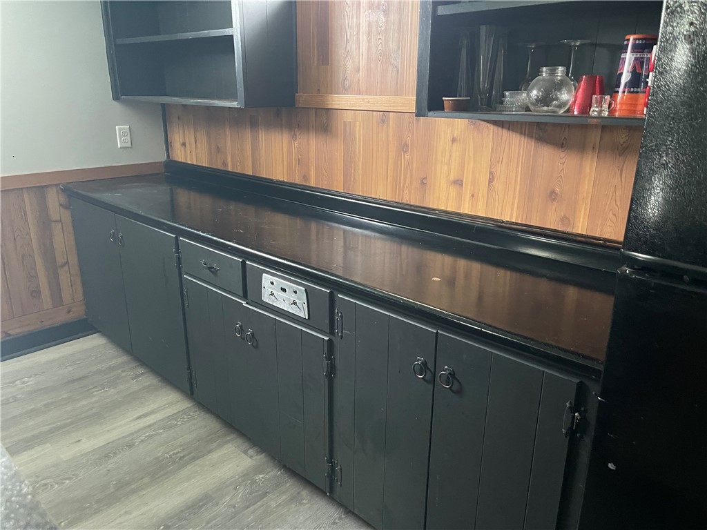 This bar area offers stylish cabinetry and ample counter space for entertaining.