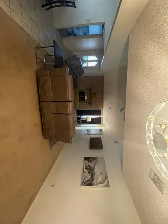 a kitchen with a refrigerator and a stove