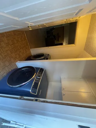 a bathroom with a sink and washing machine