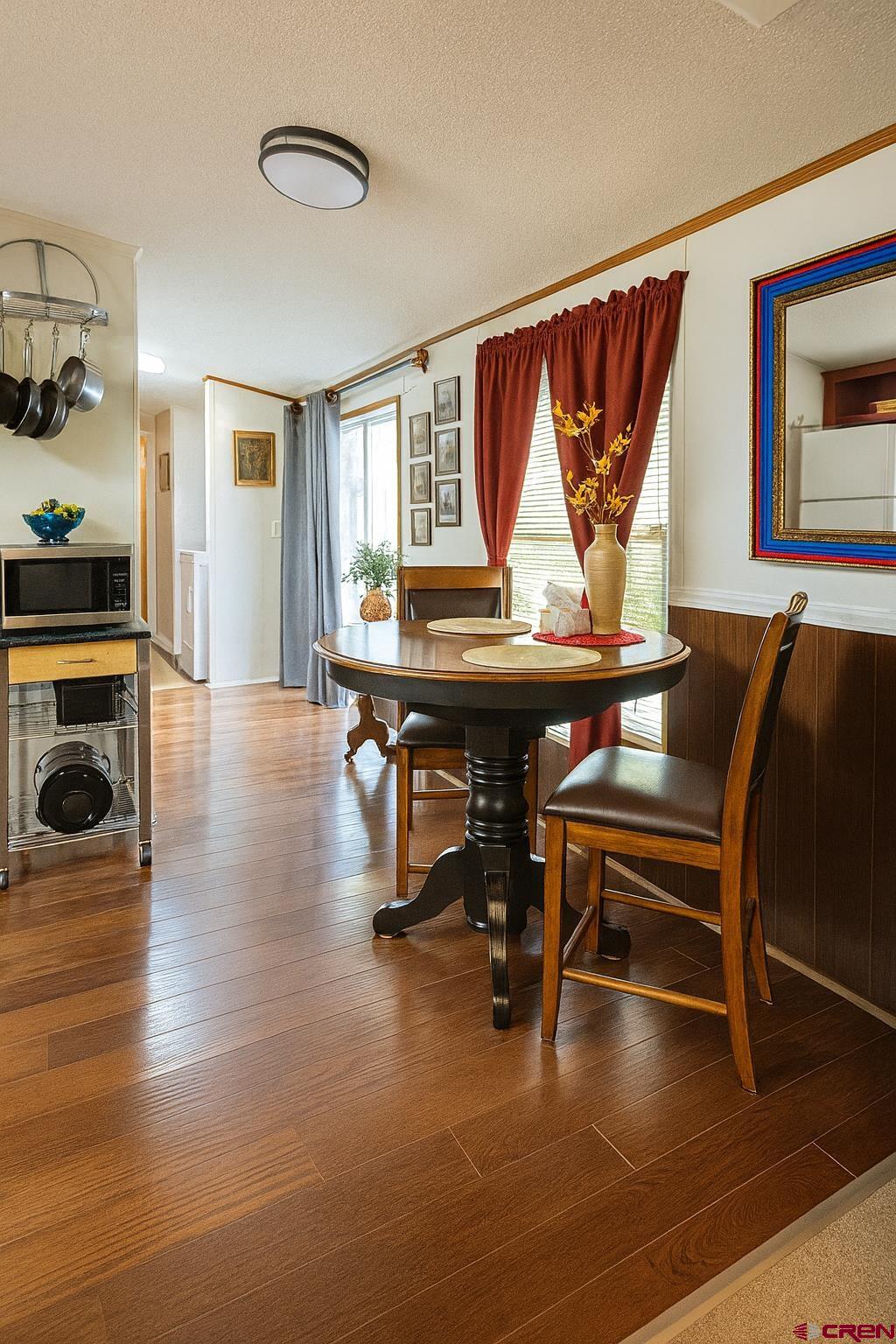 676 Highway 50, Unit SPACE #43 Delta, CO 81416 - Photo 11 of 33 a view of a livingroom with furniture window and wooden floor