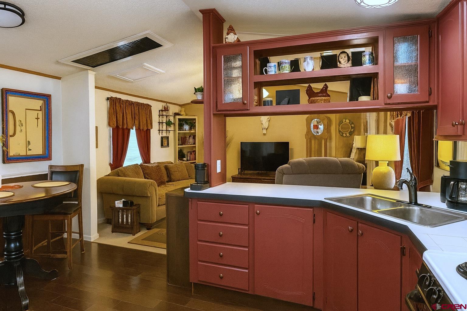 676 Highway 50, Unit SPACE #43 Delta, CO 81416 - Photo 12 of 33 a living room with furniture and a book shelf
