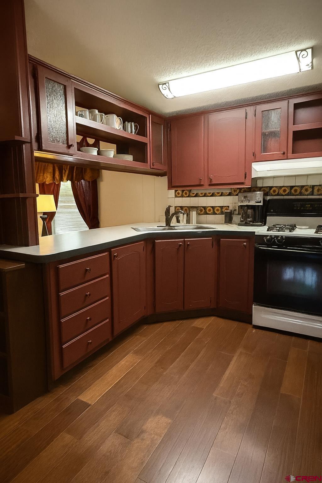 676 Highway 50, Unit SPACE #43 Delta, CO 81416 - Photo 13 of 33 a kitchen with stainless steel appliances granite countertop a stove a sink and a refrigerator