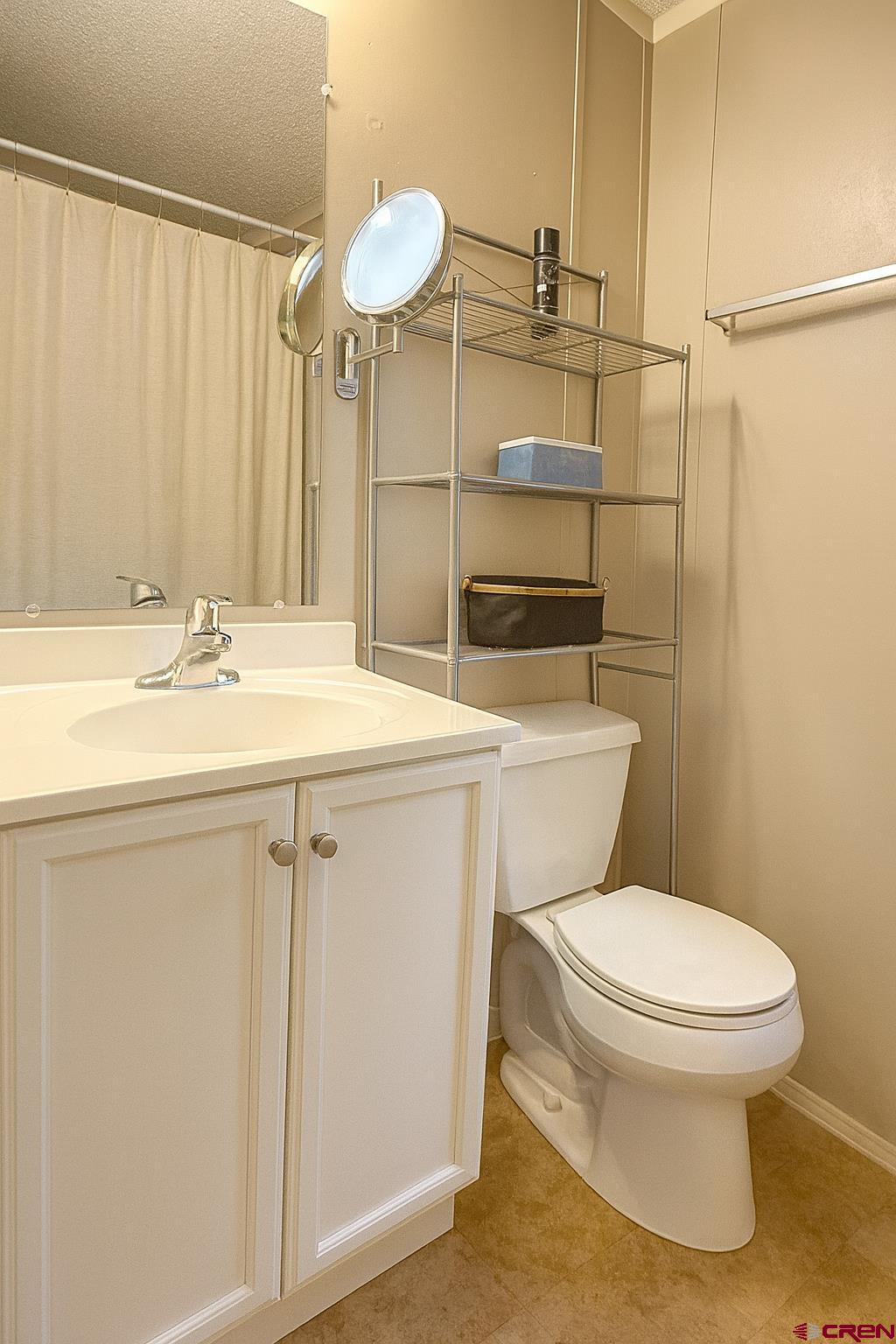 676 Highway 50, Unit SPACE #43 Delta, CO 81416 - Photo 16 of 33 a bathroom with a sink a toilet and shower
