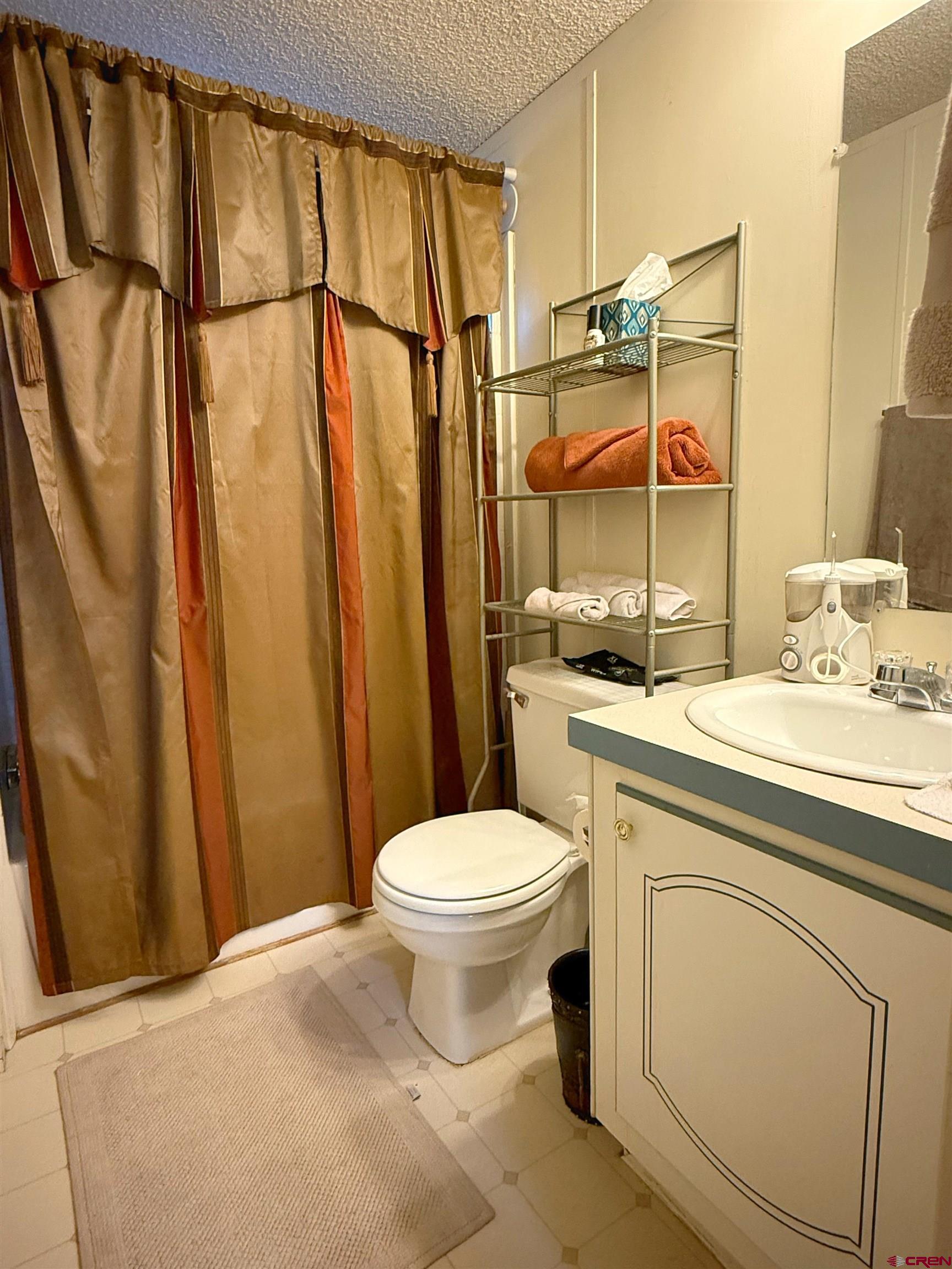 676 Highway 50, Unit SPACE #43 Delta, CO 81416 - Photo 21 of 33 a bathroom with a sink toilet and shower