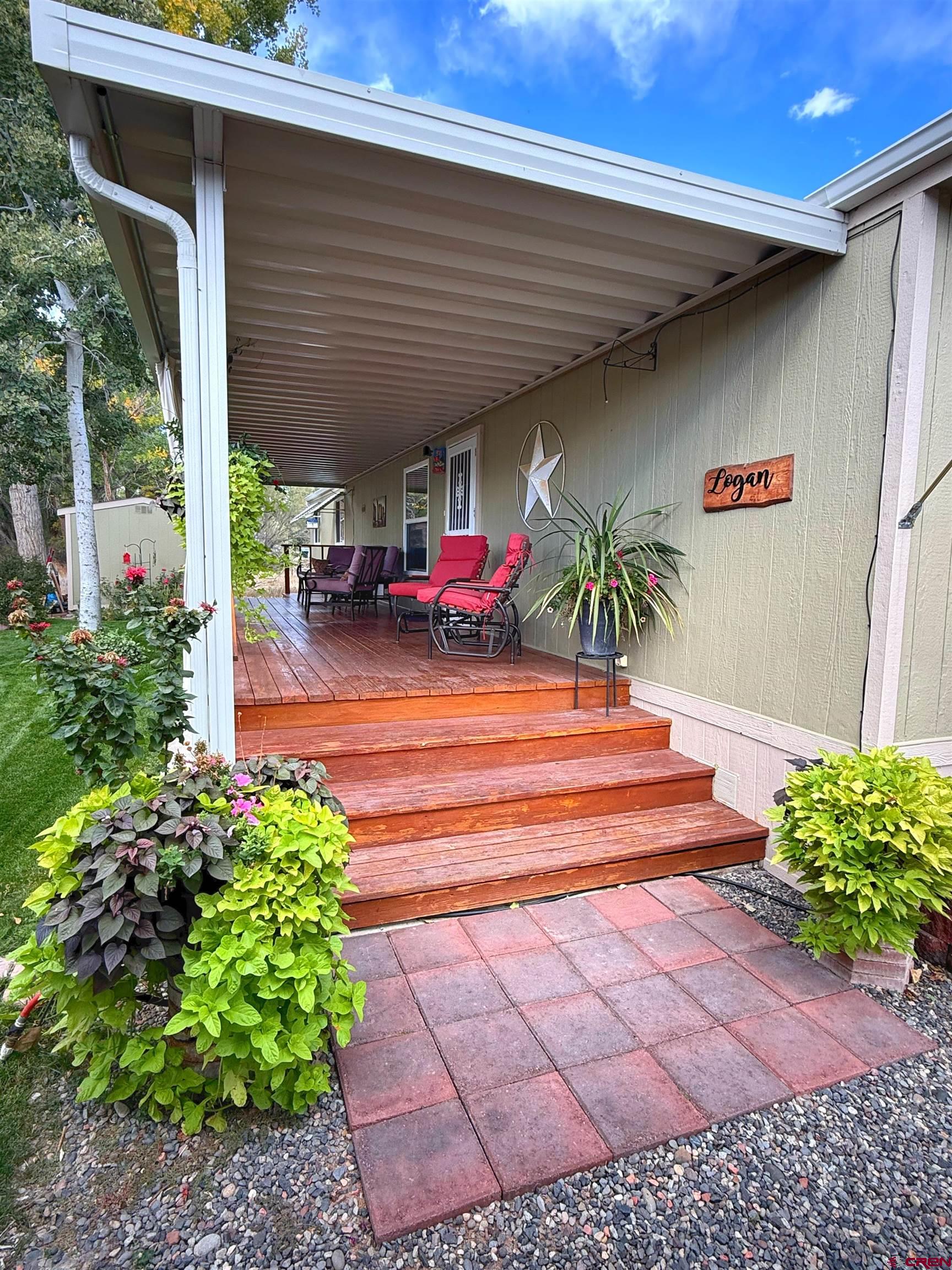676 Highway 50, Unit SPACE #43 Delta, CO 81416 - Photo 28 of 33 a view of a patio with table and chairs potted plants