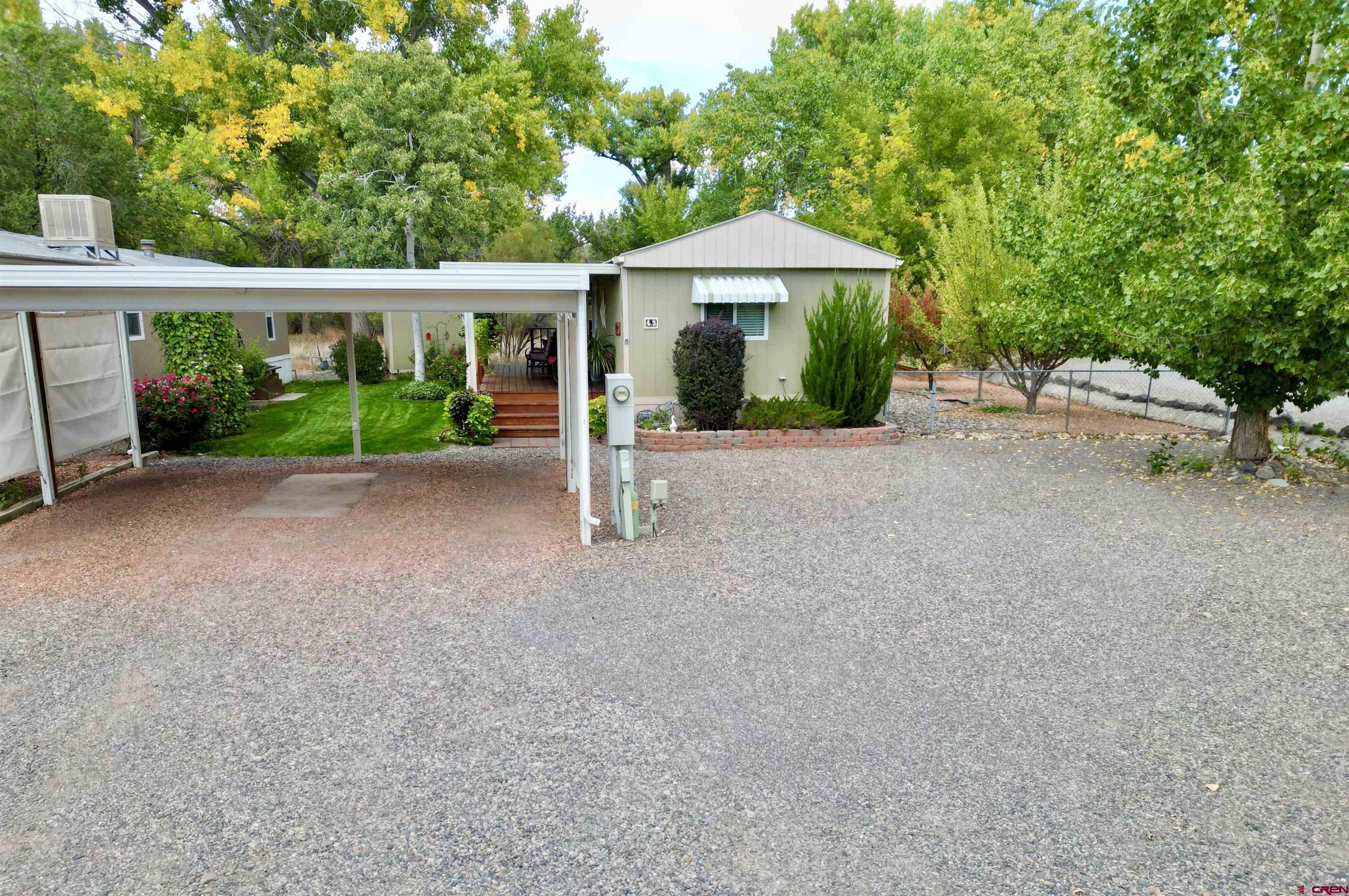 676 Highway 50, Unit SPACE #43 Delta, CO 81416 - Photo 3 of 33 a view of a house with a yard