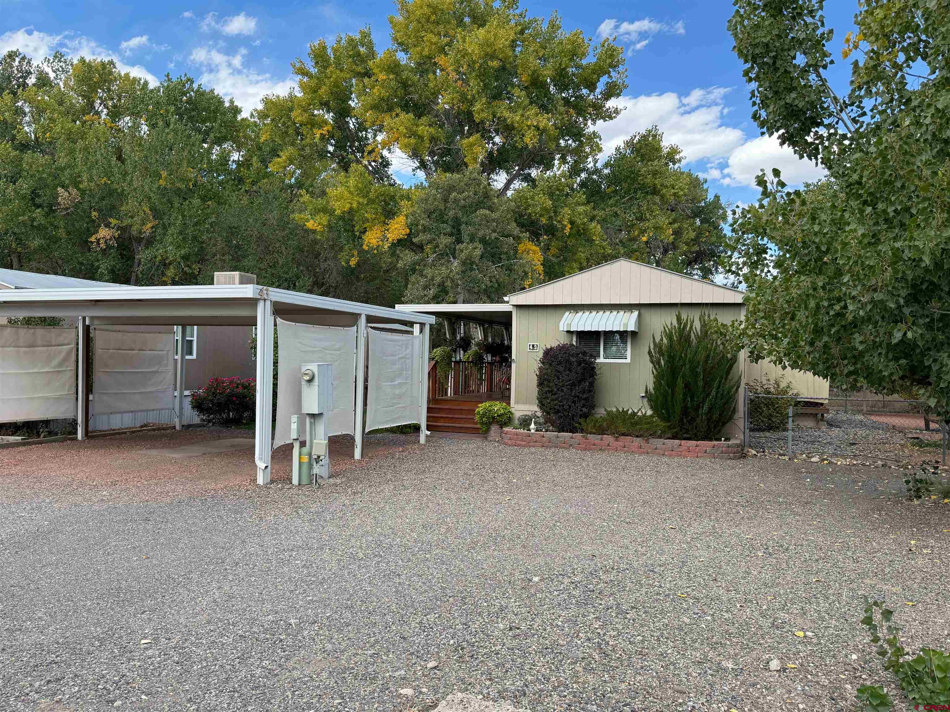 676 Highway 50, Unit SPACE #43 Delta, CO 81416 - Photo 31 of 33 a view of a house with a yard and sitting area