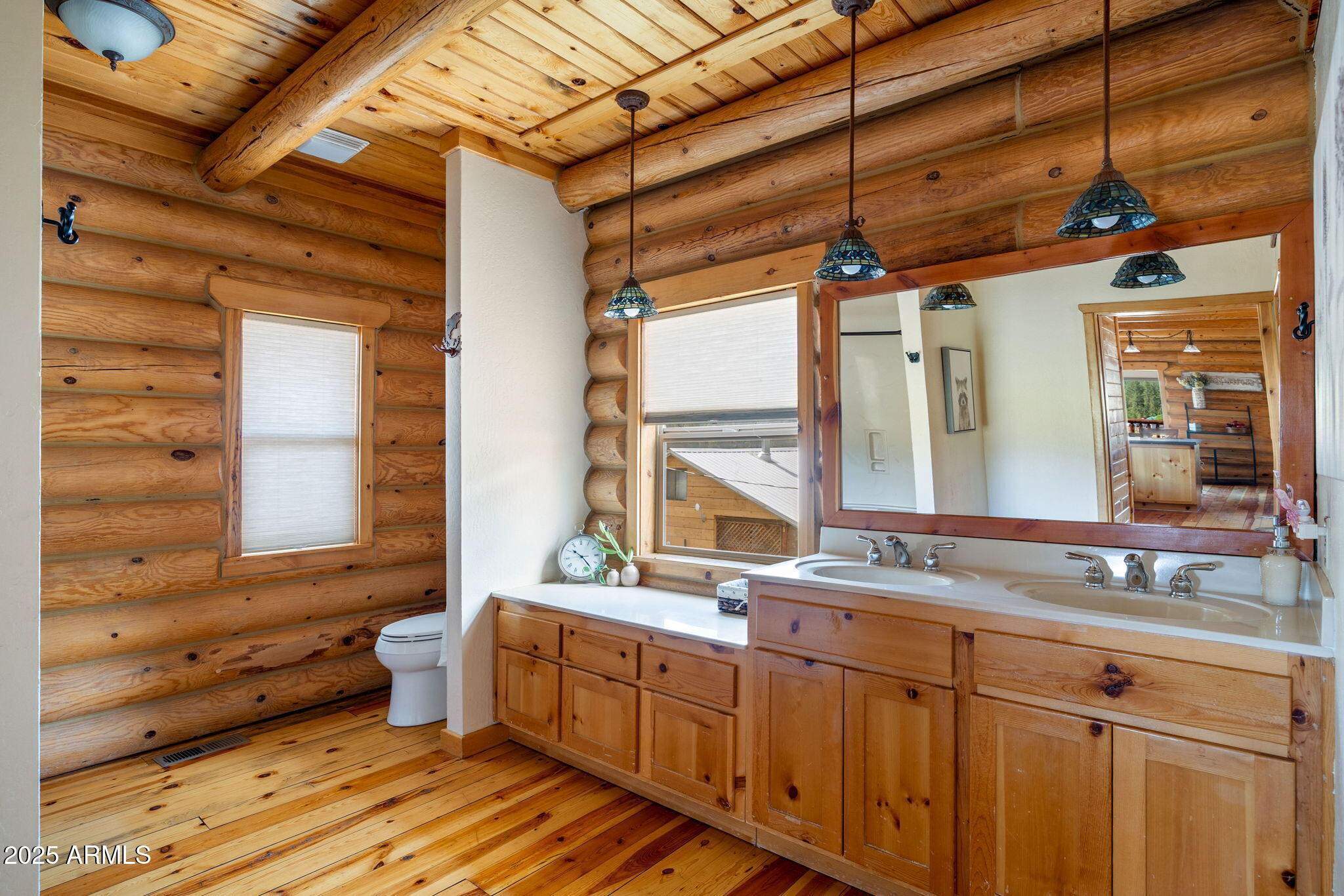 100 Main Street Greer, AZ 85927 - Photo 23 of 63 a bathroom with a granite countertop sink mirror and a bathtub