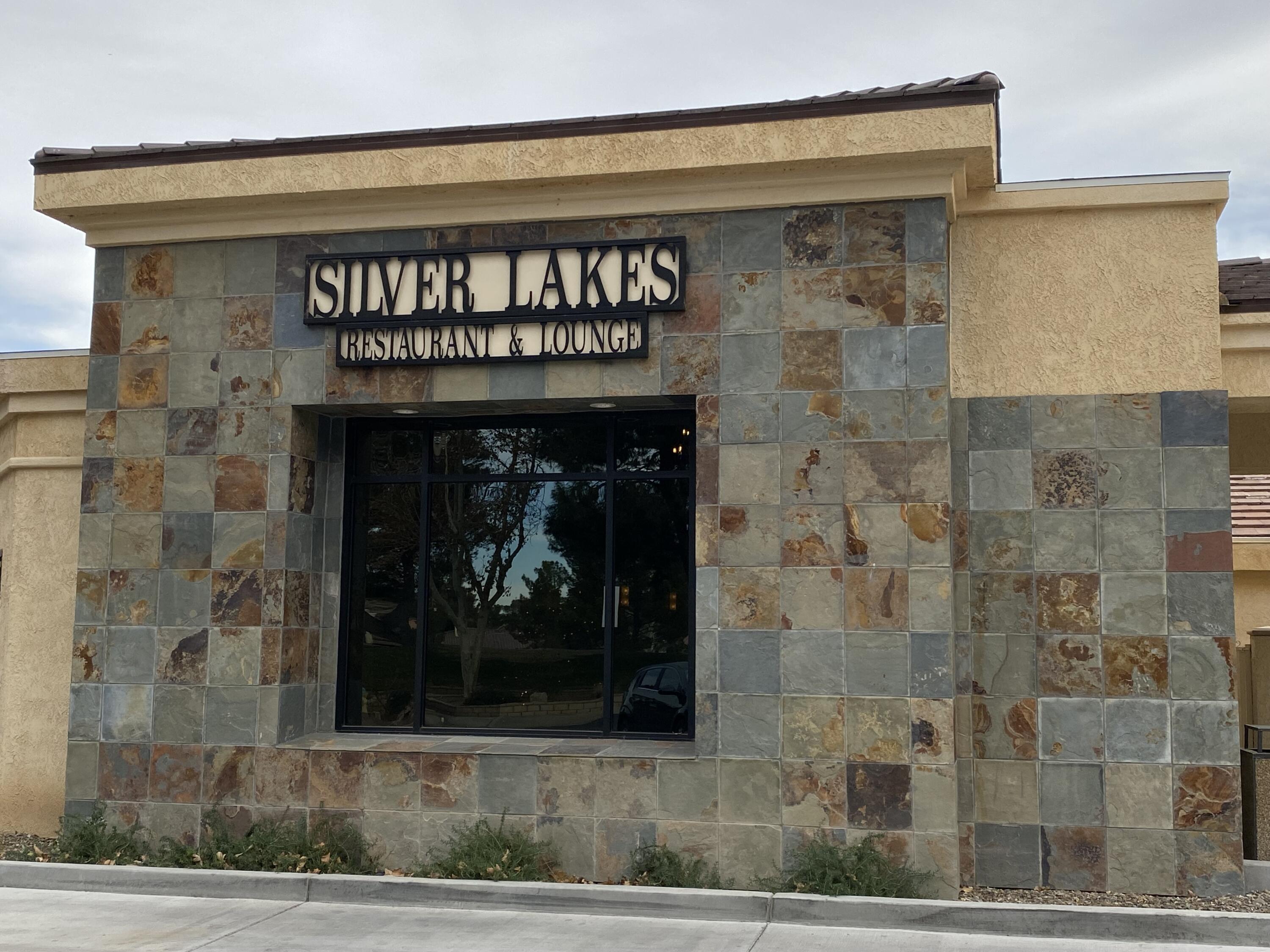 Windjammer Lane Helendale, CA 92342 - Photo 12 of 14 a front view of a building with a garden