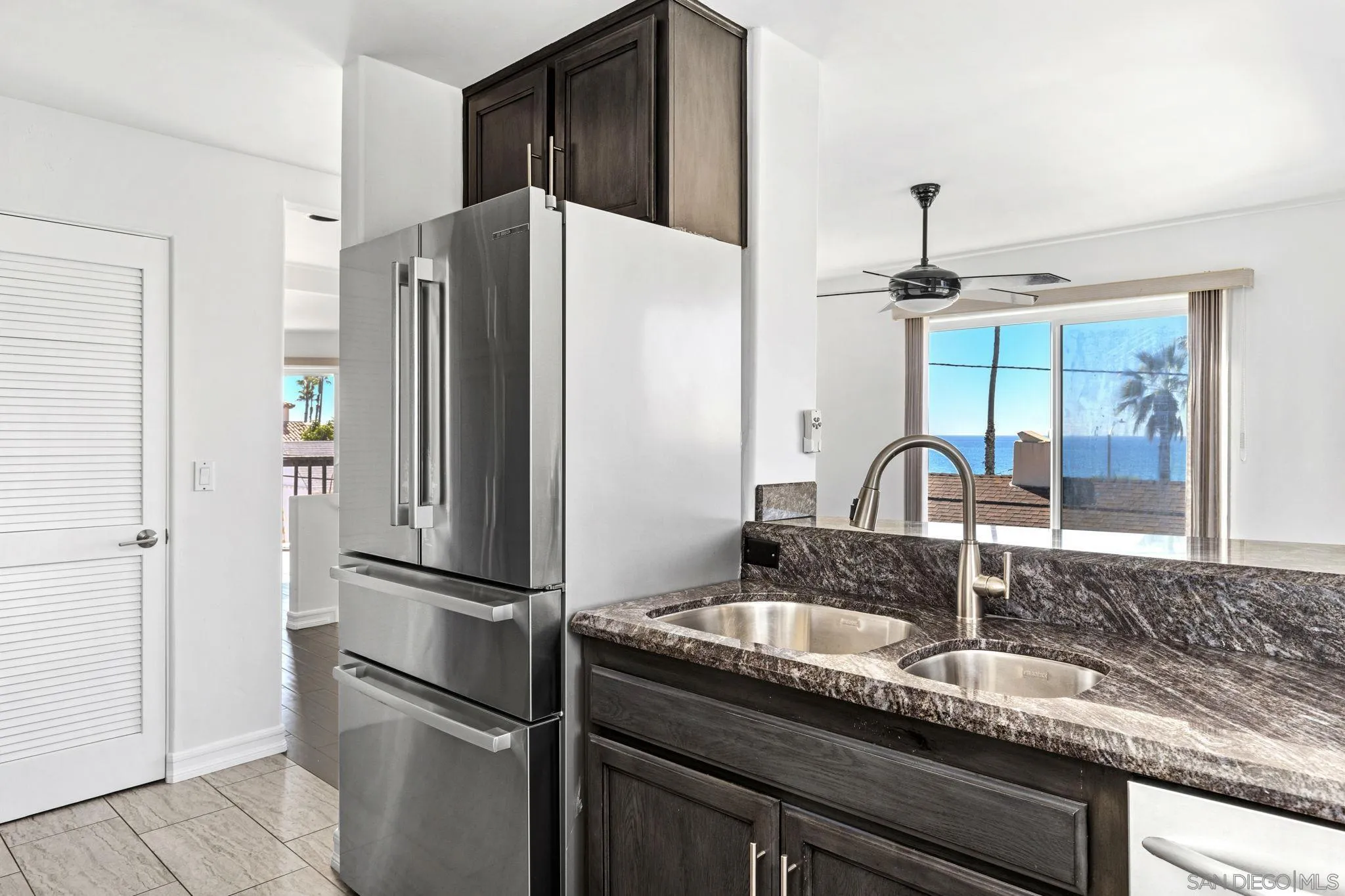 200 Pine Street, Unit 1 Oceanside, CA 92054 - Photo 12 of 28 a kitchen with granite countertop a refrigerator and a sink