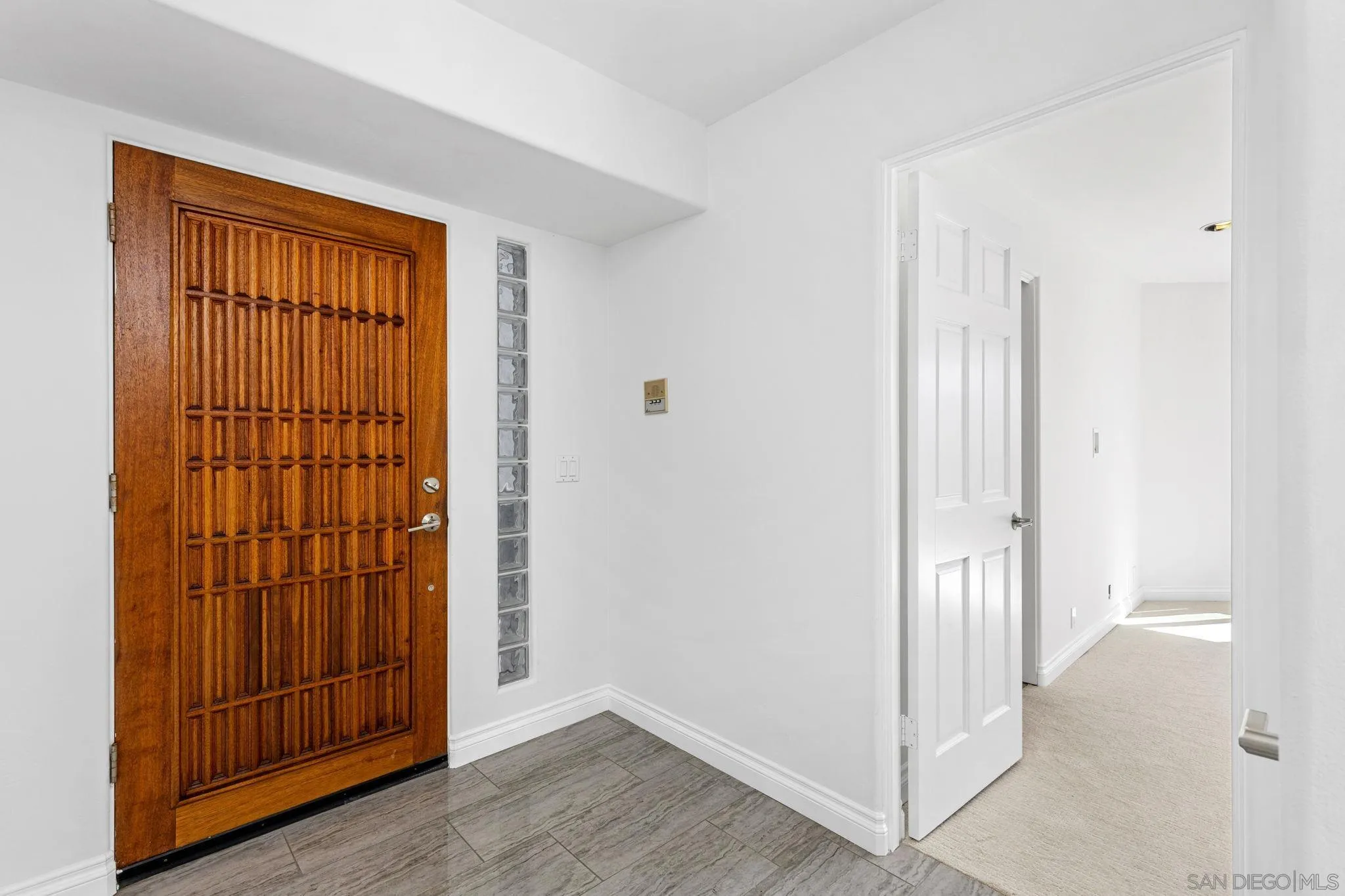 200 Pine Street, Unit 1 Oceanside, CA 92054 - Photo 20 of 28 an empty room with wooden floor and windows