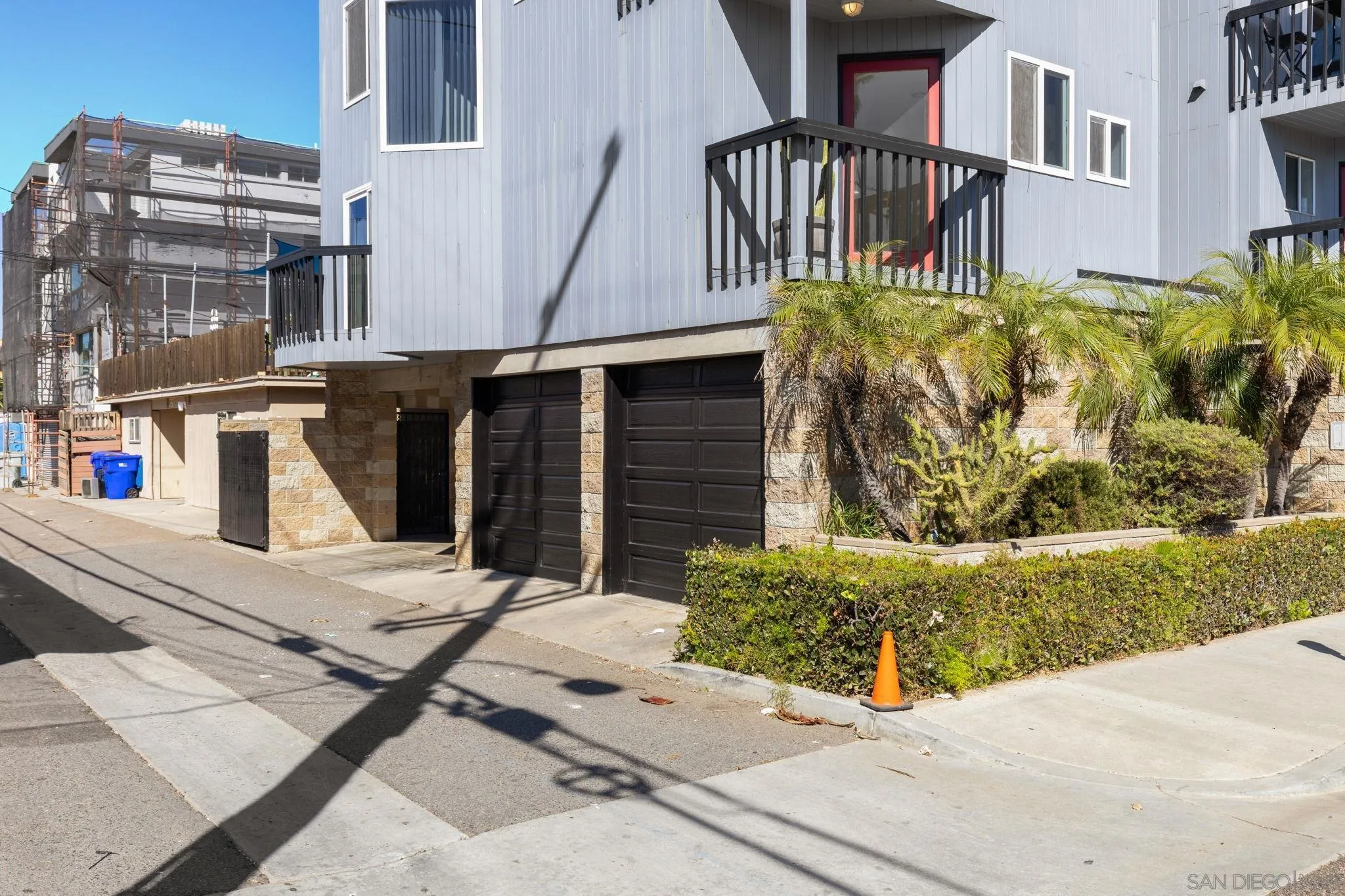 200 Pine Street, Unit 1 Oceanside, CA 92054 - Photo 22 of 28 a view of a brick house with plants and windows
