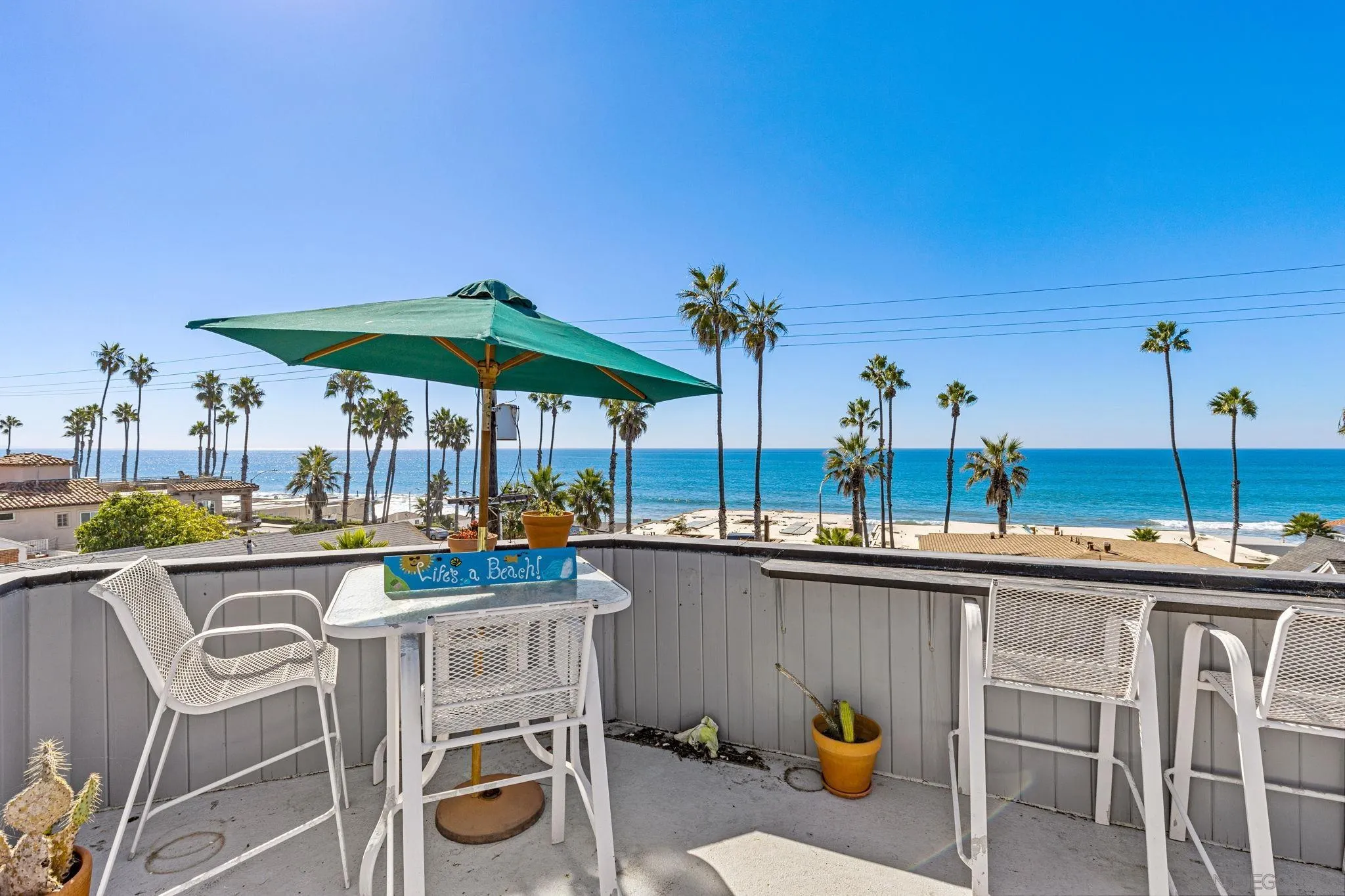 200 Pine Street, Unit 1 Oceanside, CA 92054 - Photo 24 of 28 a view of a chairs and table in patio with a barbeque grill