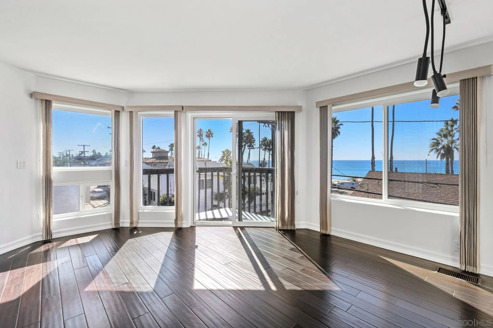 200 Pine Street, Unit 1 Oceanside, CA 92054 - Photo 5 of 28 a view of a room with wooden floor and a window