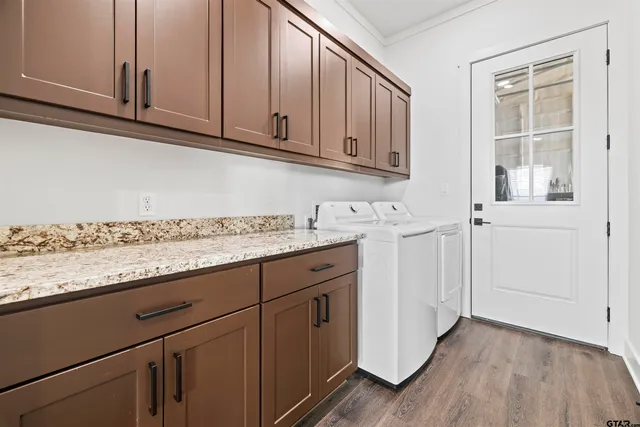a view of cabinets with granite countertop wooden cabinets