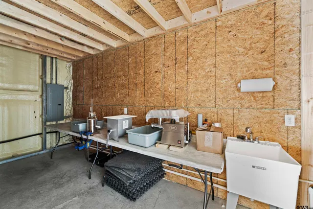 a room with table chairs and a walk in closet