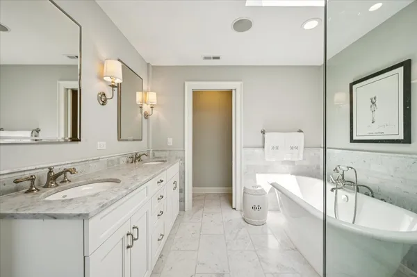 a bathroom with 2 sink and a mirror