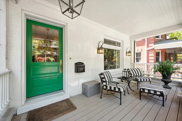 a balcony with furniture and a window