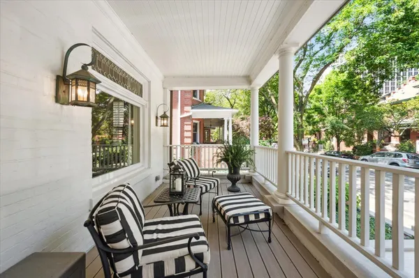 a view of a balcony with chairs