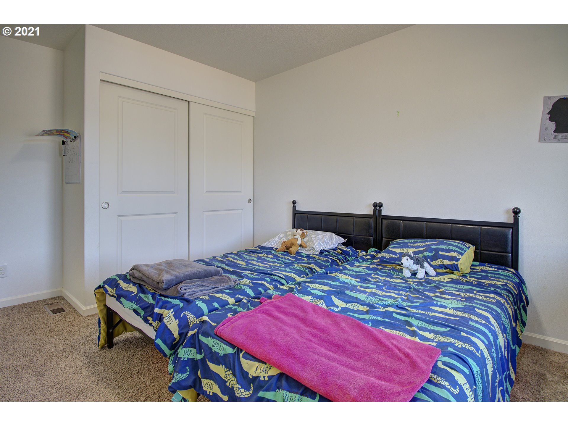 2312 South Sauk Way Ridgefield, WA 98642 - Photo 18 of 29 a bedroom with a bed and wooden floor