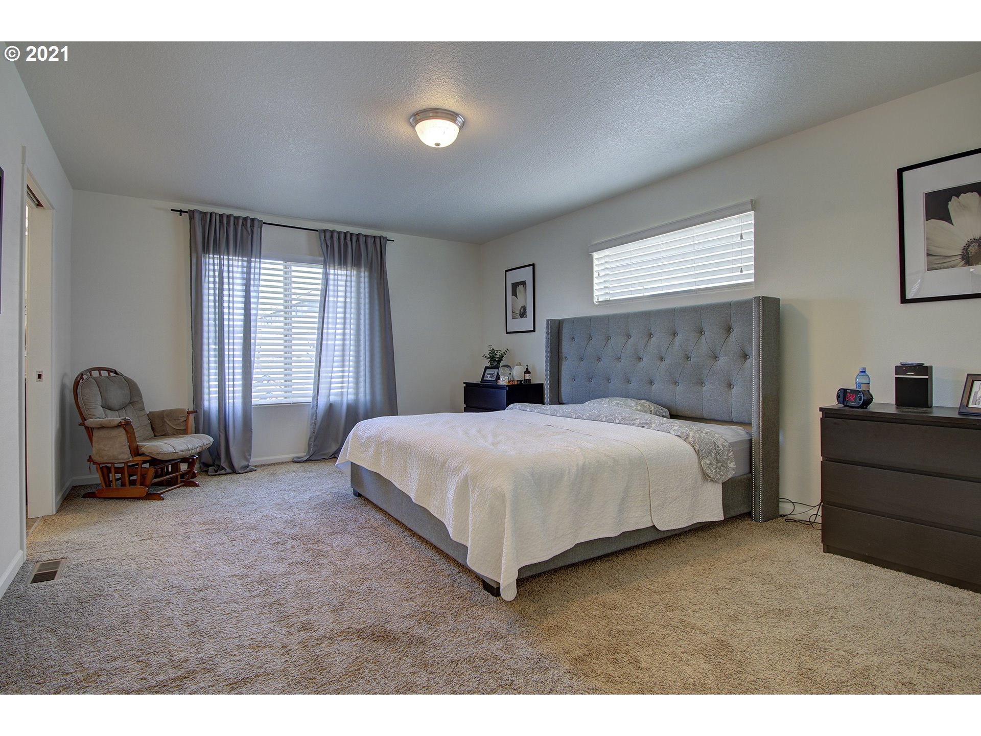 2312 South Sauk Way Ridgefield, WA 98642 - Photo 25 of 29 a bedroom with a bed a table and a dresser