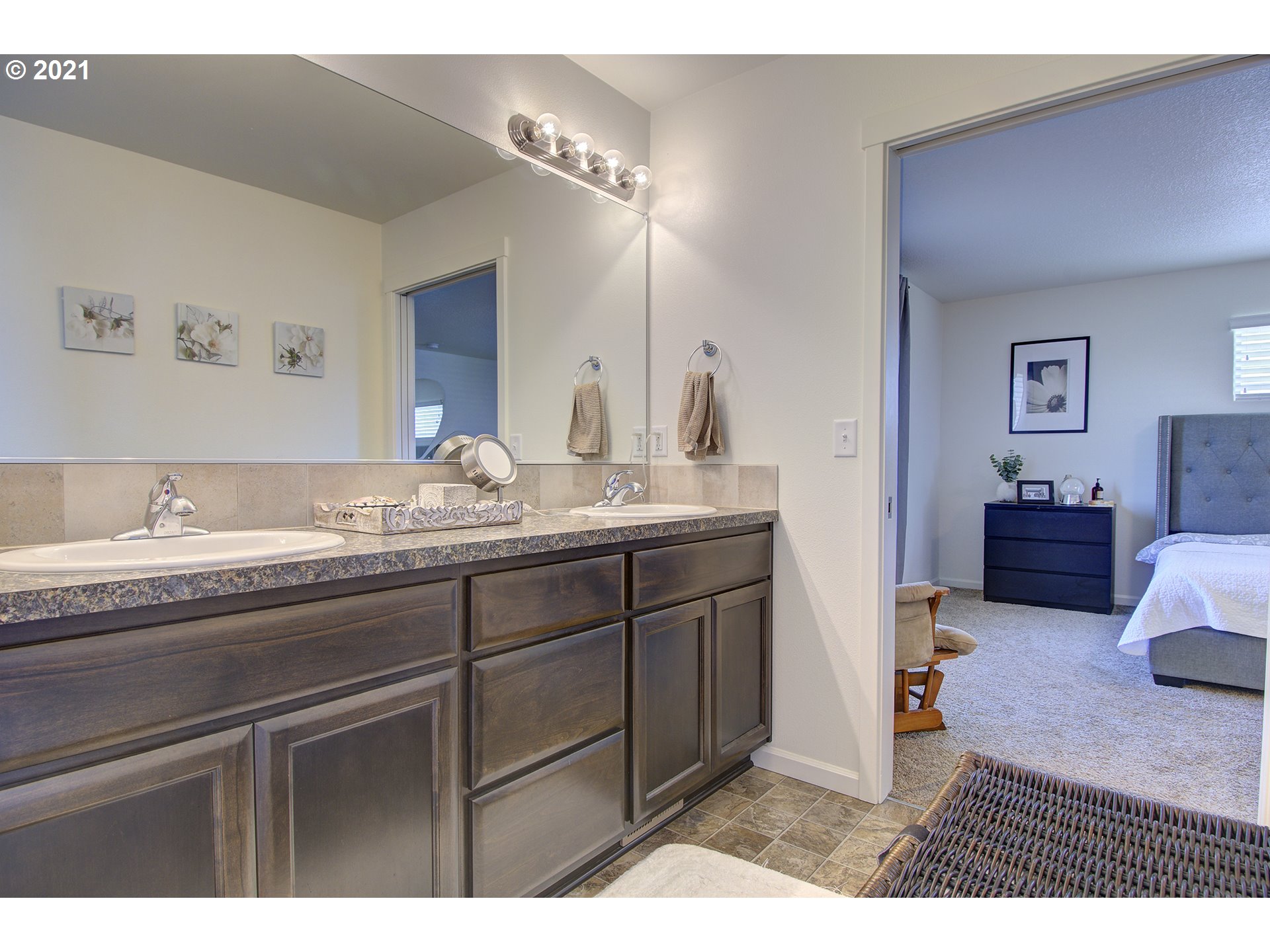 2312 South Sauk Way Ridgefield, WA 98642 - Photo 26 of 29 a bathroom with a sink double vanity and a mirror