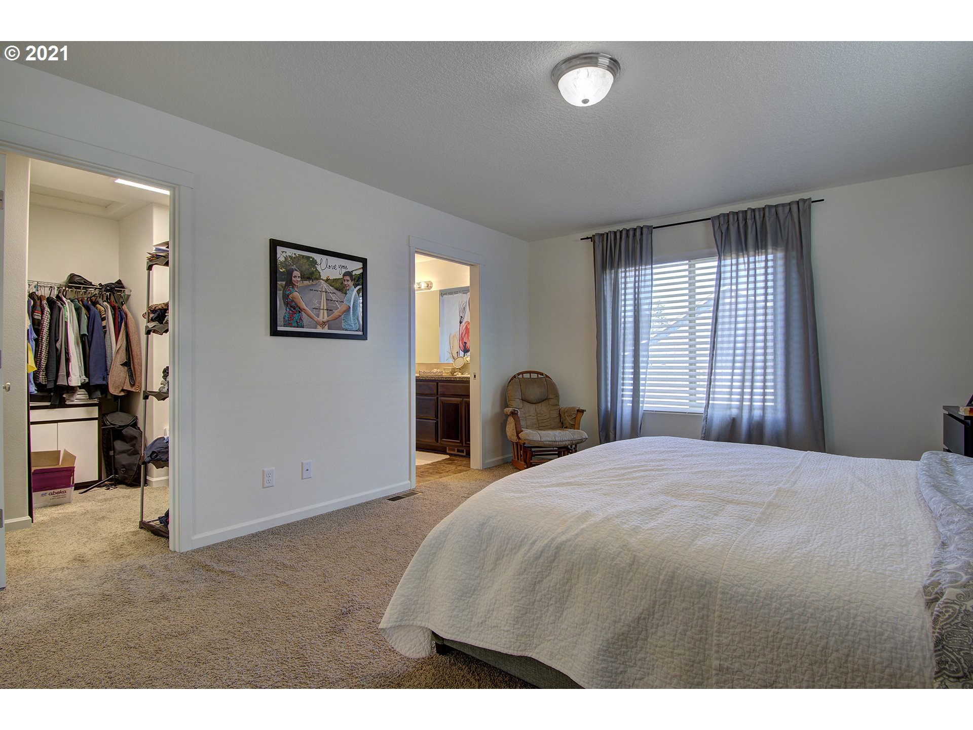 2312 South Sauk Way Ridgefield, WA 98642 - Photo 27 of 29 a bedroom with a bed and a view of kitchen