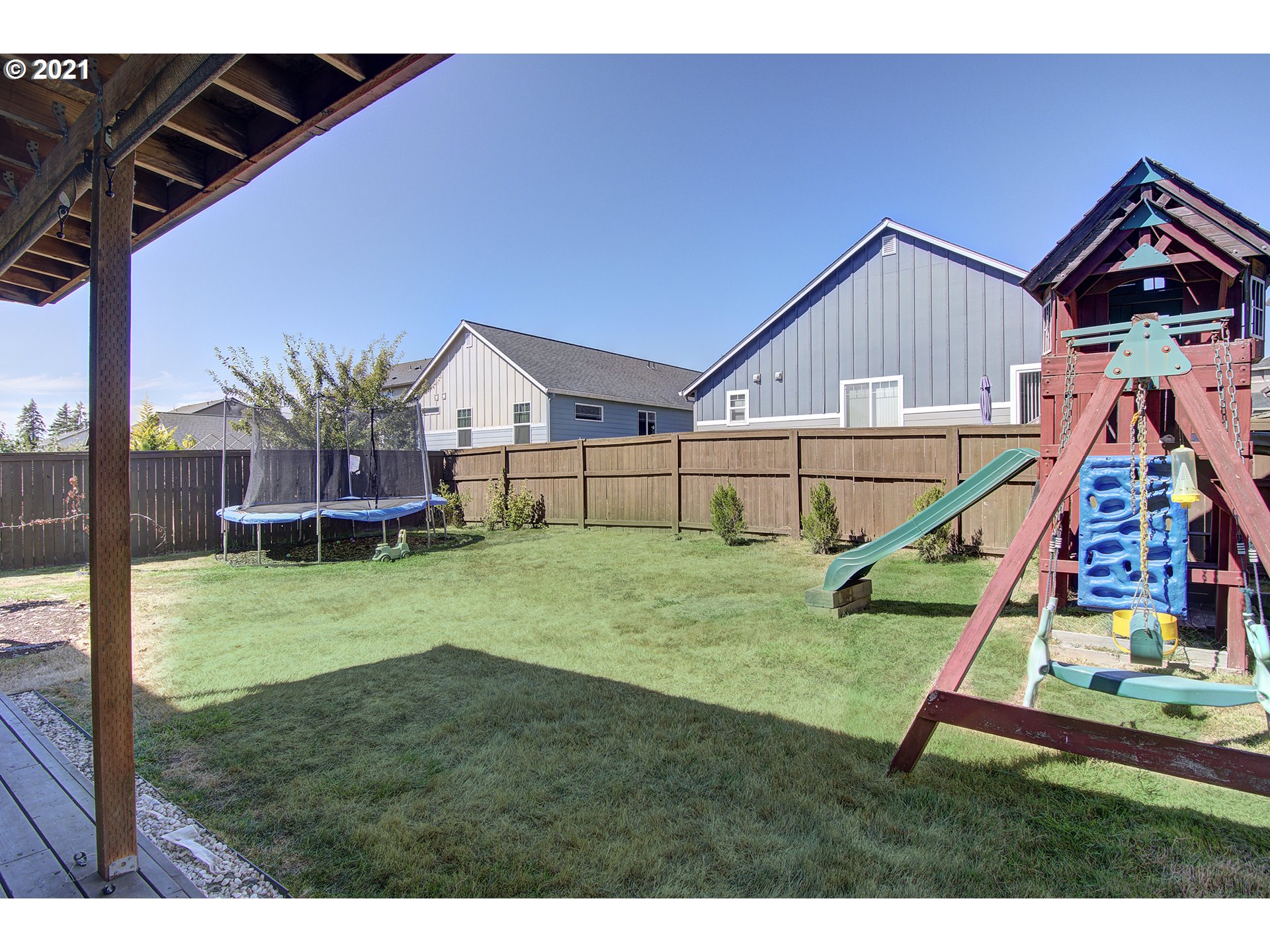 2312 South Sauk Way Ridgefield, WA 98642 - Photo 28 of 29 a view of an house with backyard and a slide