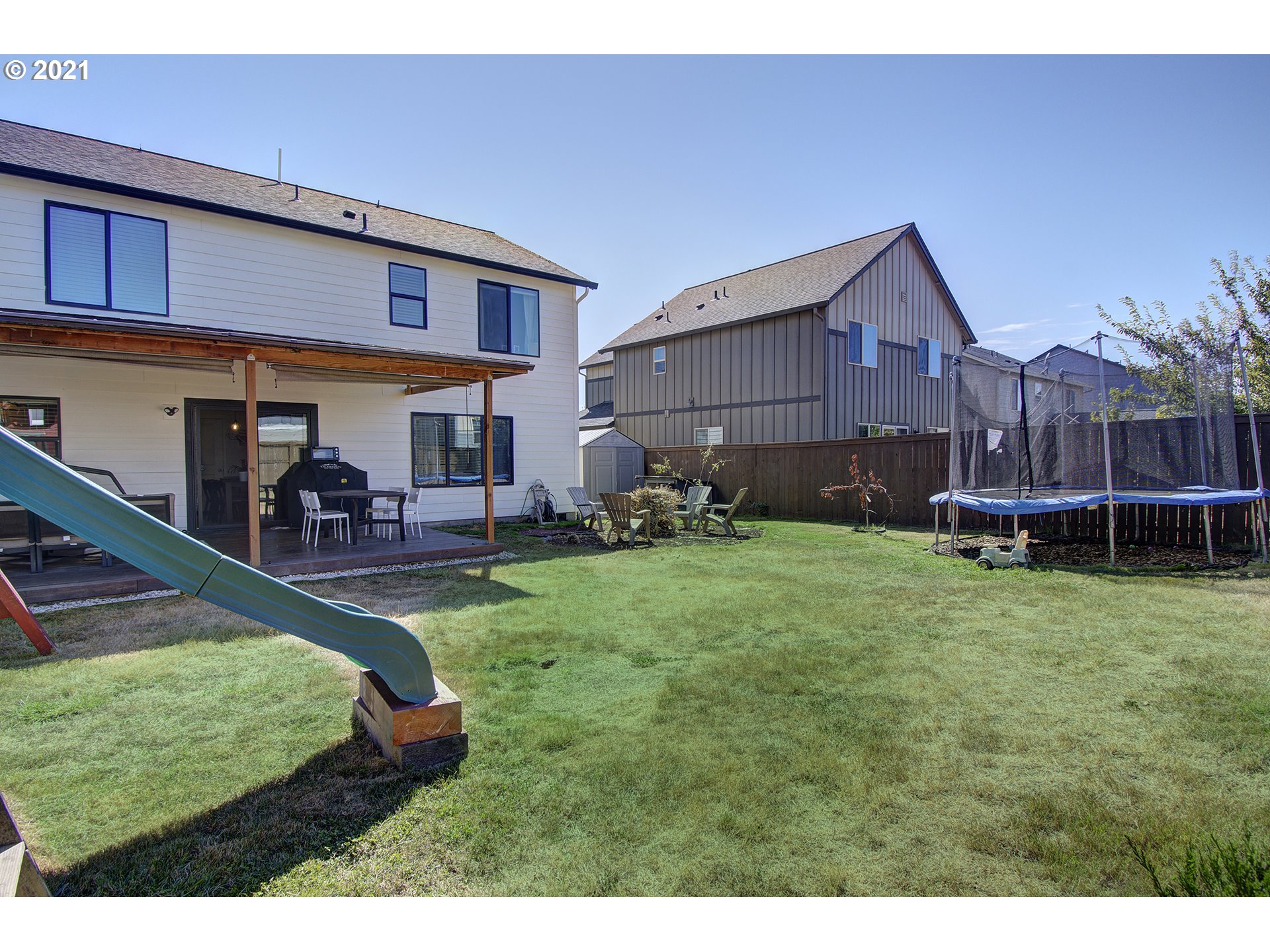 2312 South Sauk Way Ridgefield, WA 98642 - Photo 29 of 29 a backyard of a house with table and chairs