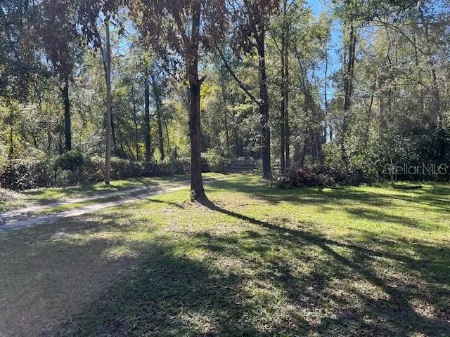 a view of swimming pool with a yard