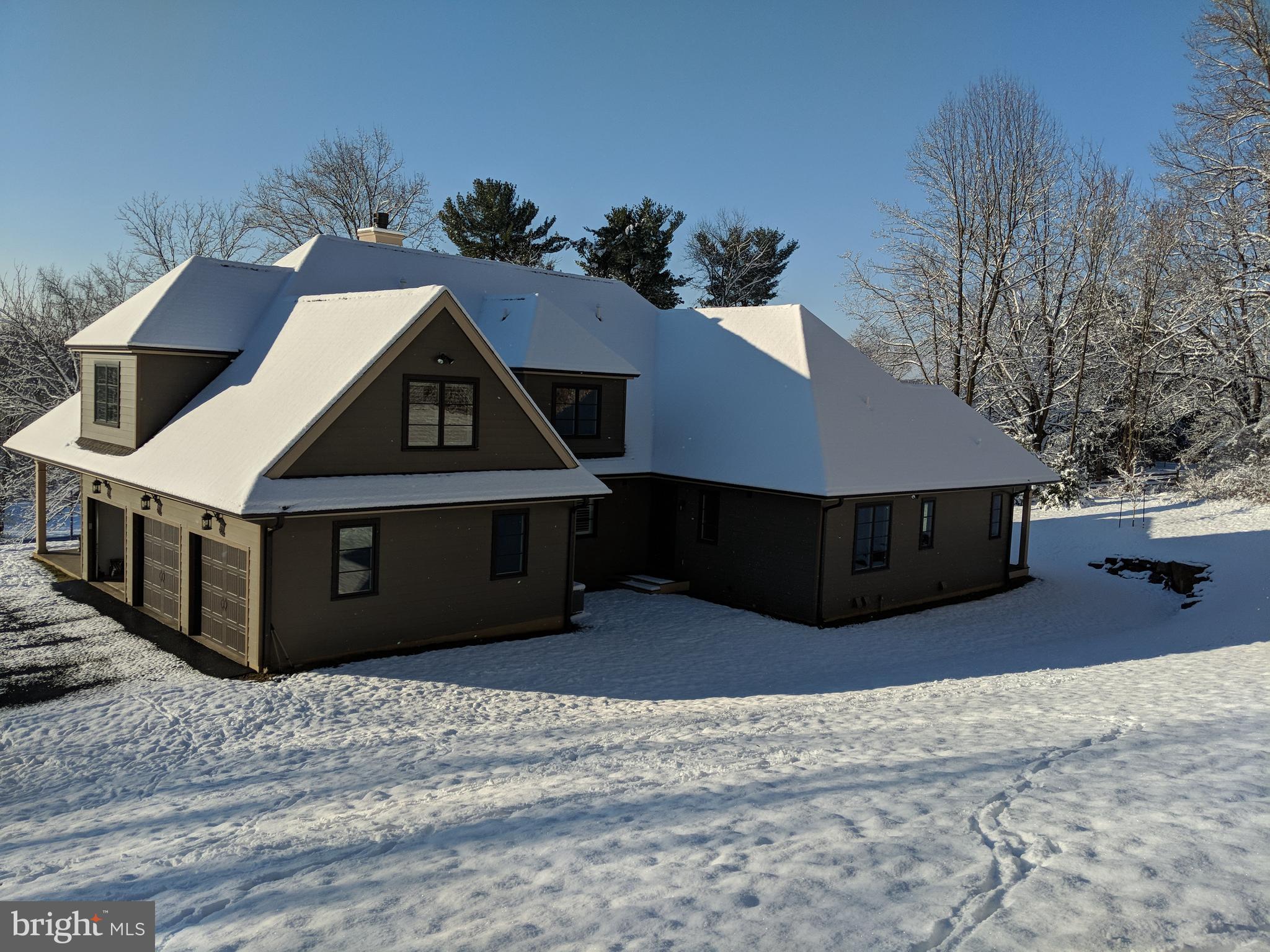 Winter scene of garage and rear