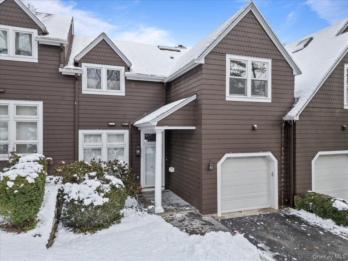 View of front of home with an attached garage