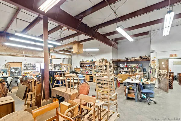 a large room with lots of multiple furniture