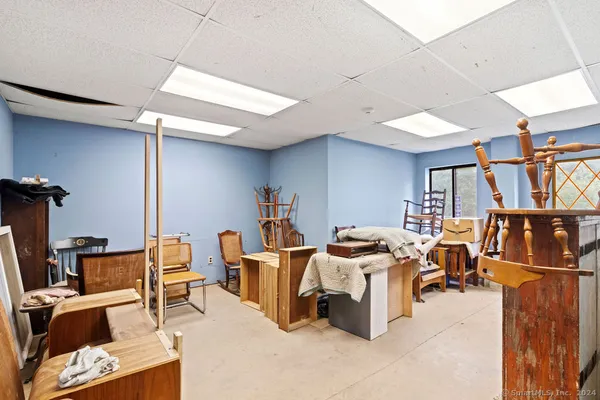 a dining room with a table chairs and entryway