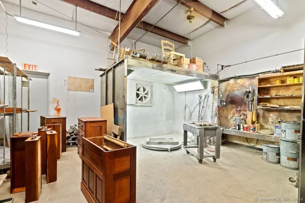 a room with lots of furniture and clutter