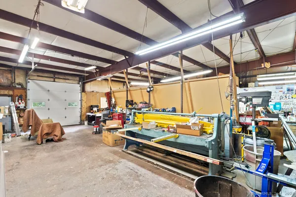 a room with furniture a washer and dryer
