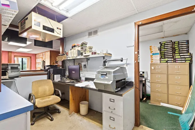 a view of living room with furniture and flat screen tv