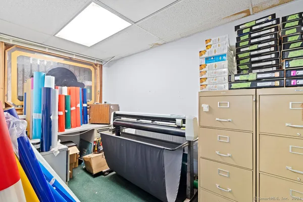 a dining room with furniture and window