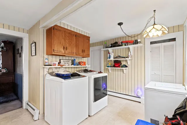 a kitchen with a stove a refrigerator and a sink