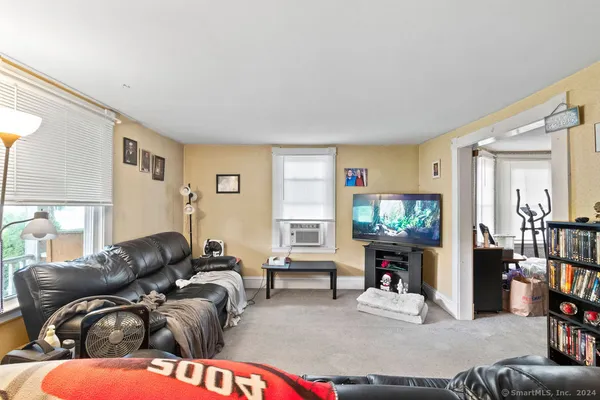 a view of a workspace with furniture and toys