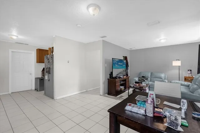 a living room with furniture and a table