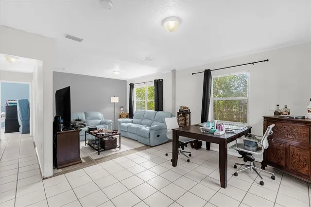 a living room with furniture and a window