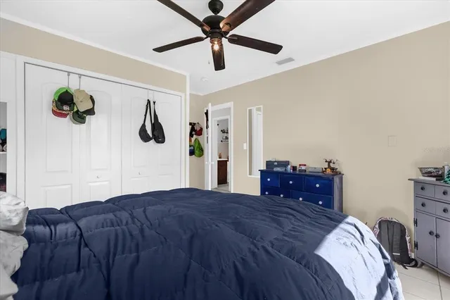 a bedroom with a bed and a dresser