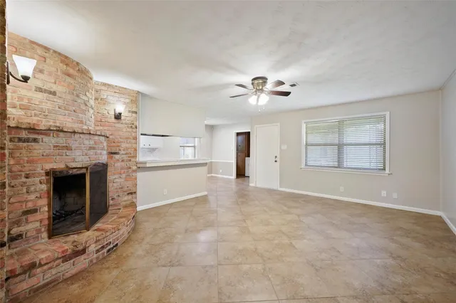 a kitchen with granite countertop cabinets a sink a stove and a refrigerator