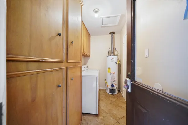 a view of a backyard with a garden and entertaining space