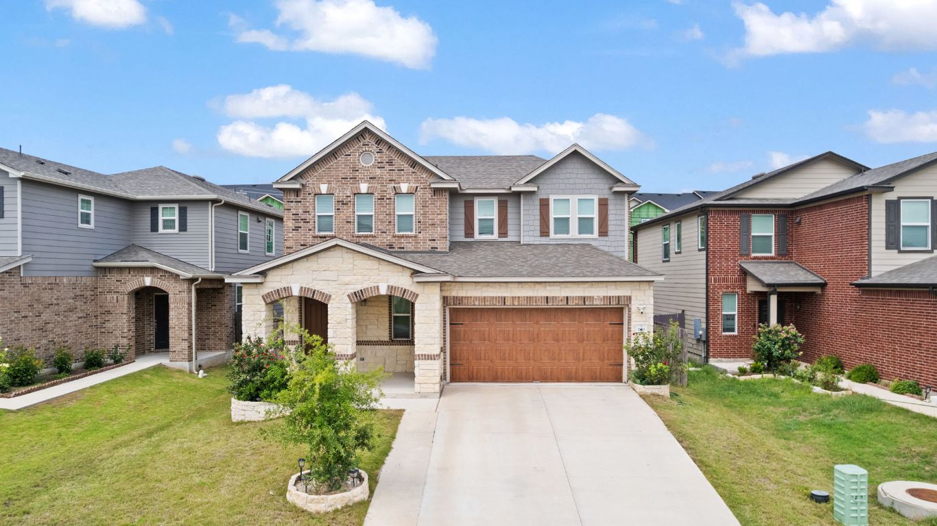 200 Lemon Light Lane Pflugerville, TX 78660 - Photo 1 of 1 a front view of a house with a yard and garage