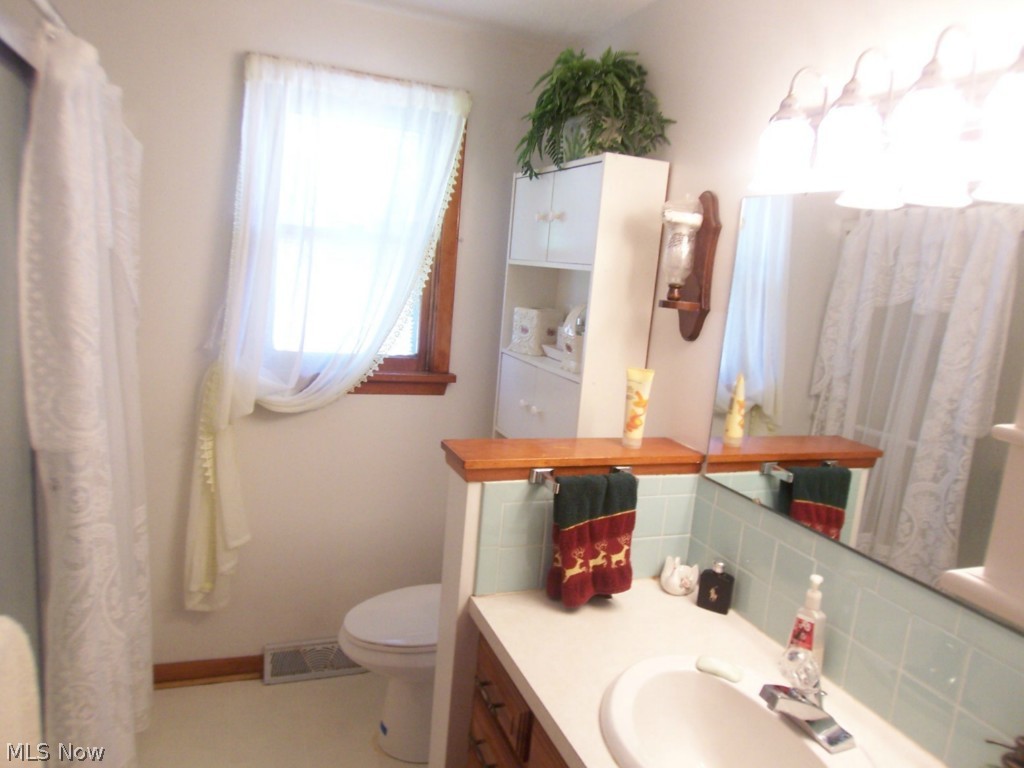 1608 Meister Road Lorain, OH 44053 - Photo 9 of 25 A nice bright bathroom that makes it so easy to apply makeup with perfect lighting fixtures over the mirror.