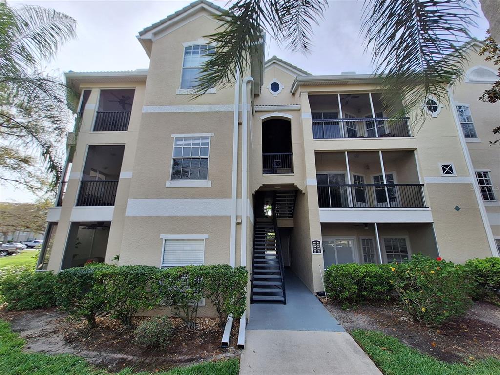5140 Northridge Road, Unit 102 Sarasota, FL 34238 - Photo 1 of 32 a front view of a house with a yard