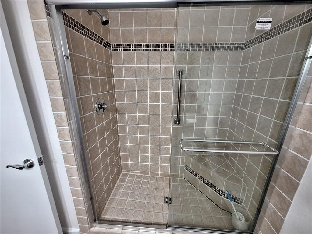 5140 Northridge Road, Unit 102 Sarasota, FL 34238 - Photo 17 of 32 a bathroom with a shower