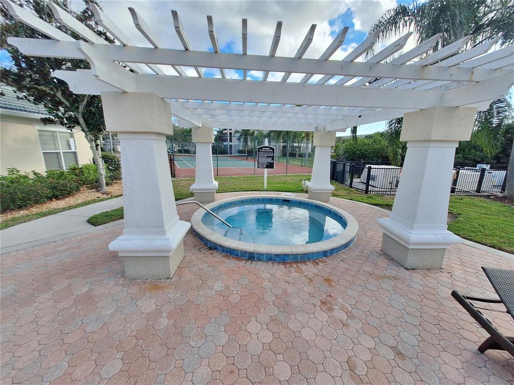 5140 Northridge Road, Unit 102 Sarasota, FL 34238 - Photo 26 of 32 a view of a house with swimming pool and porch with furniture